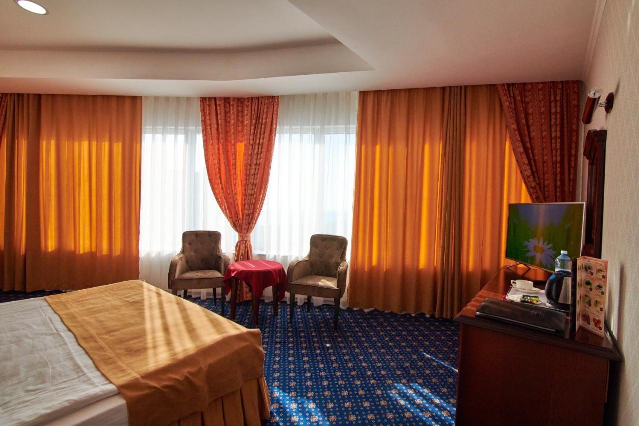 Grand Hotel Victory Aktau  Exterior photo A room at the hotel
