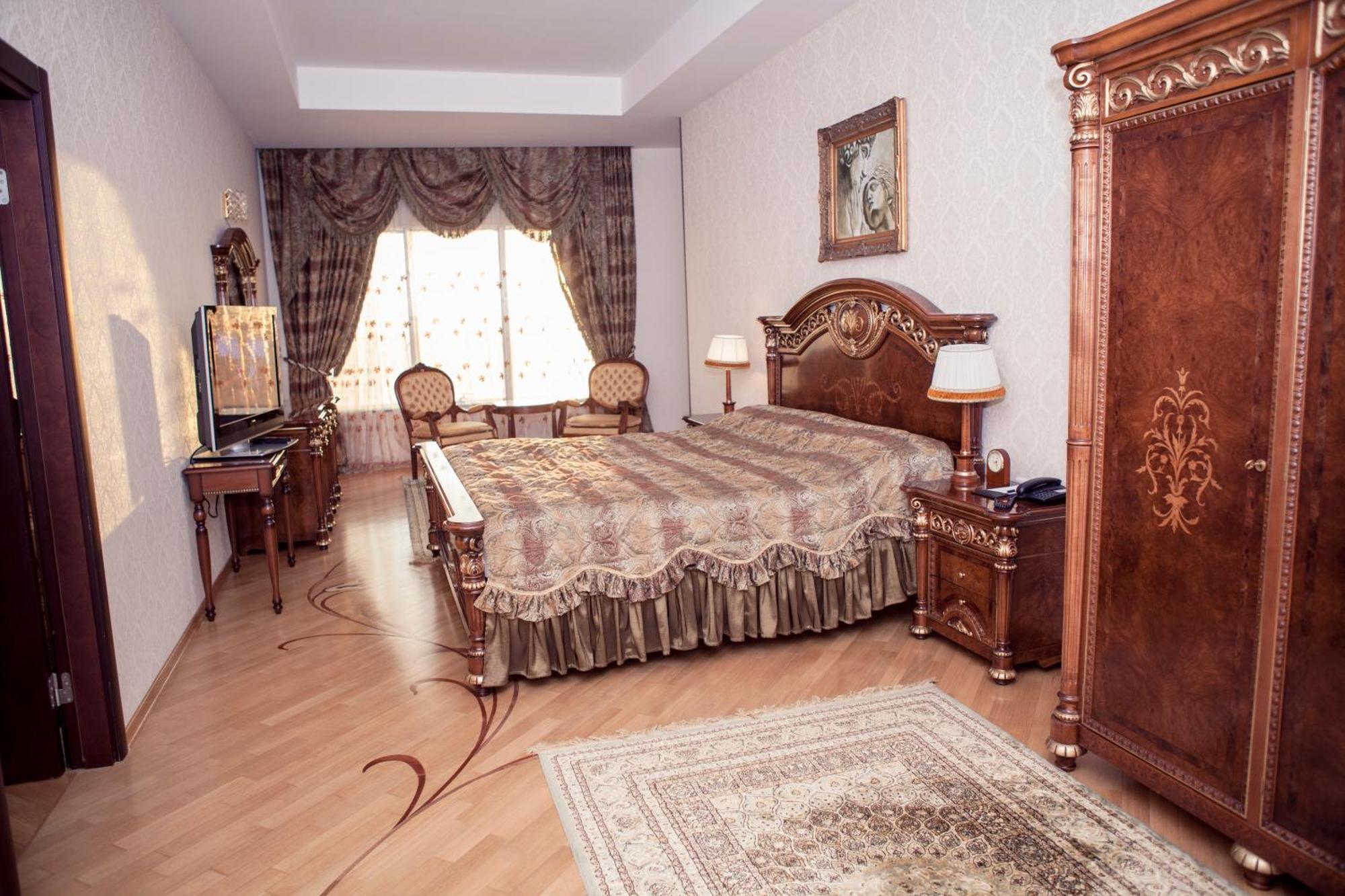 Grand Hotel Victory Aktau  Exterior photo A bedroom